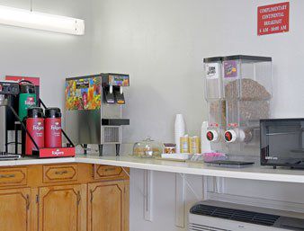Relax Inn كانتون المطعم الصورة